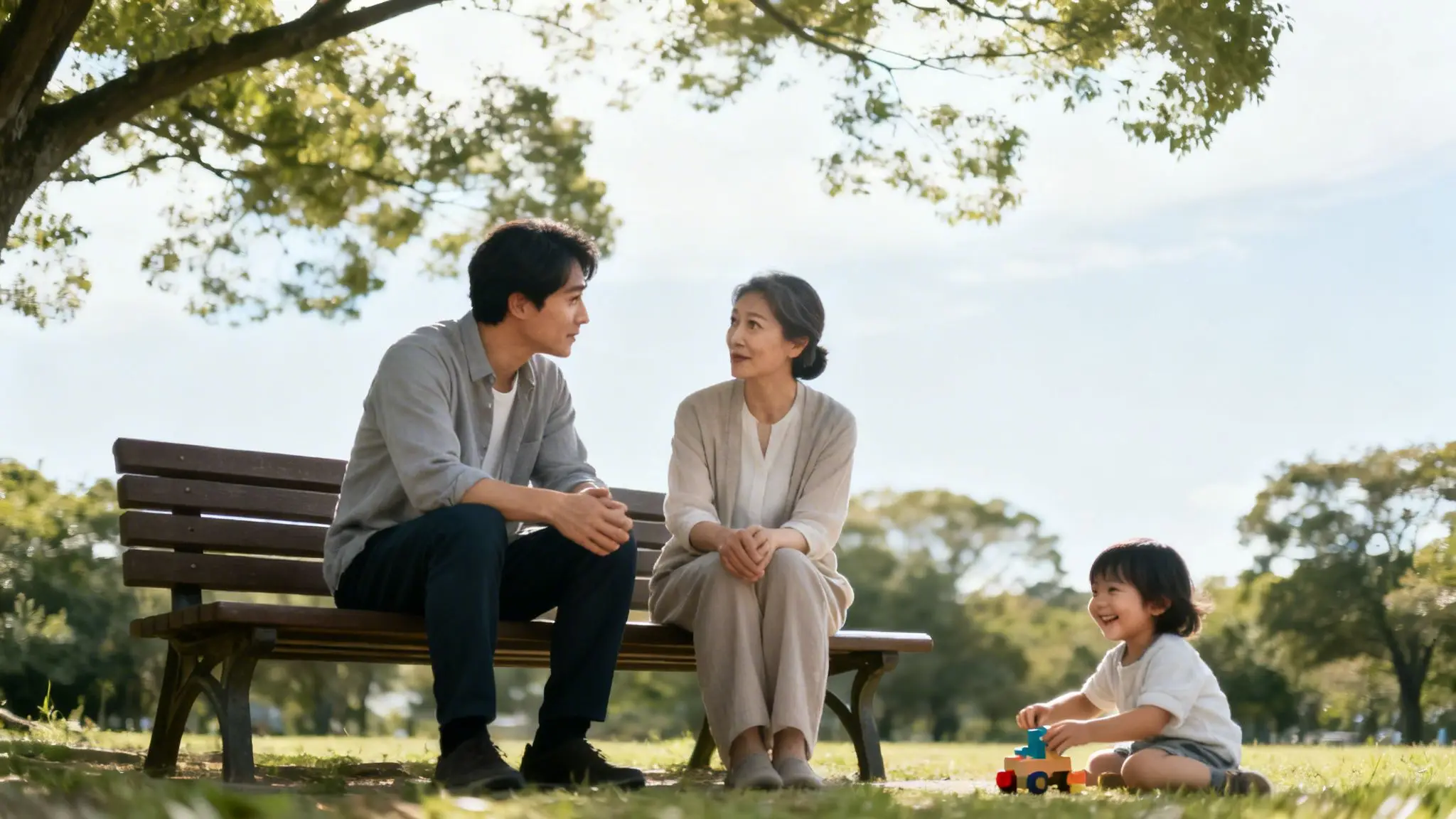 Estate Planning for Single Parents: A Guide to Securing Your Child's Future in Arkansas 2 Happy multi-generational family enjoying a sunny day in a park, adults on a bench, child playing with a toy.